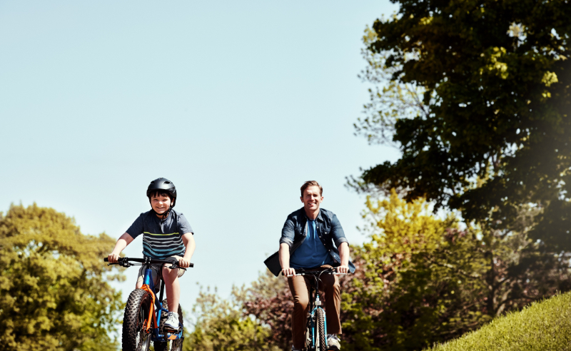 father and son riding bike